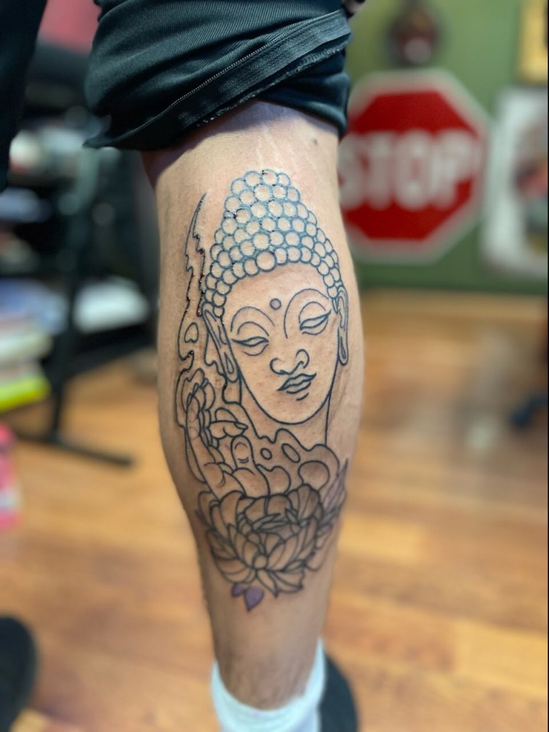 Custom black and grey Buddha tattoo by Bobby Rotten